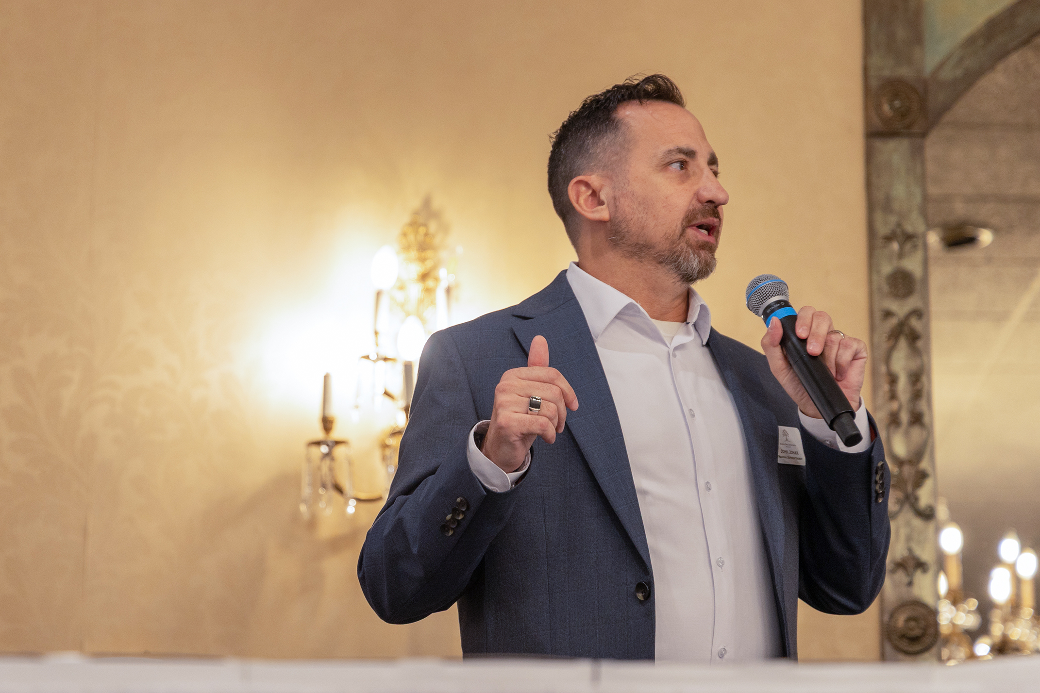 John delivering keynote address